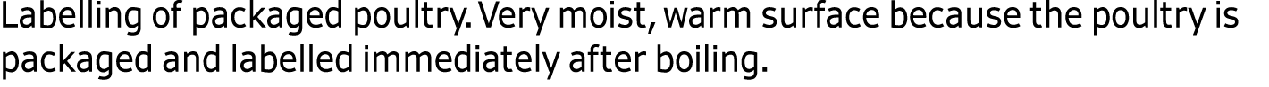 Labelling of packaged poultry. Very moist, warm surface because the poultry is packaged and labelled immediately afte...